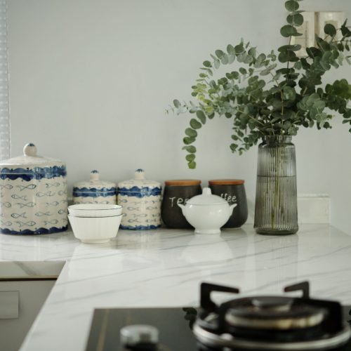 arrangement-of-kitchenware-on-marble-counter-2026-03-18-05-37-22-utc